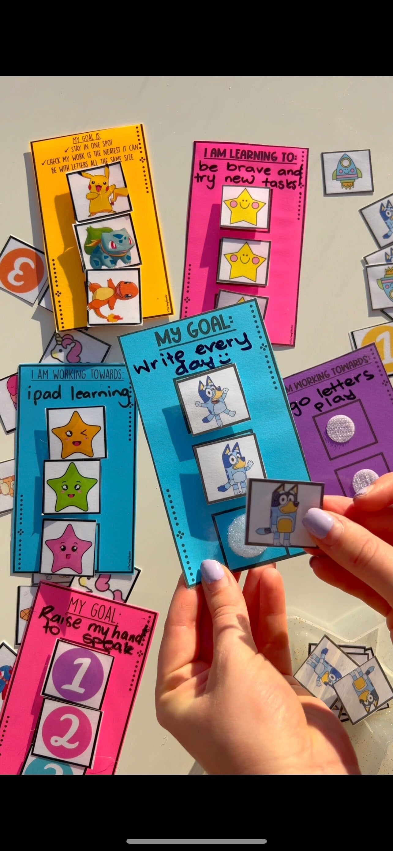 Individual rewards for students with engaging tokens like stars, ice-cream, and superheroes.